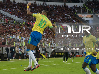 Brazilian national team players celebrate after scoring a goal during the 2026 FIFA World Cup qualifier against Venezuela at the Monumental...