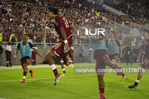 Venezuelan national team players celebrate after scoring a goal during the 2026 FIFA World Cup qualifier against Brazil at the Monumental st...