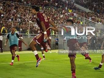 Venezuelan national team players celebrate after scoring a goal during the 2026 FIFA World Cup qualifier against Brazil at the Monumental st...