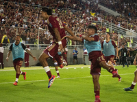 Venezuelan national team players celebrate after scoring a goal during the 2026 FIFA World Cup qualifier against Brazil at the Monumental st...