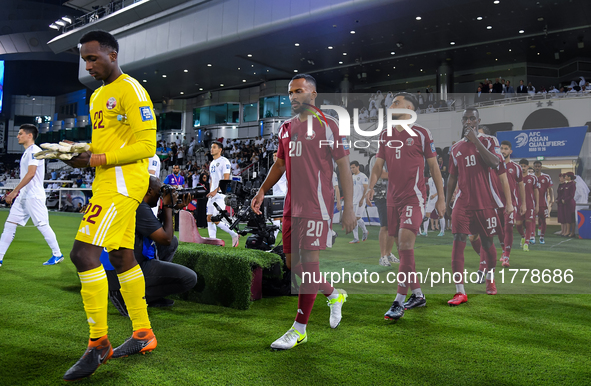 Qatar and Uzbekistan players walk onto the pitch before the FIFA World Cup 2026 AFC Asian Qualifiers 3rd round group A match between Qatar a...