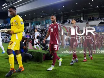 Qatar and Uzbekistan players walk onto the pitch before the FIFA World Cup 2026 AFC Asian Qualifiers 3rd round group A match between Qatar a...