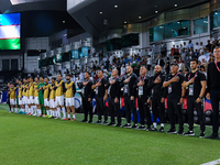 Uzbekistan National team head coach Srecko Katanec, his staff, and substitutes line up for the national anthem before the FIFA World Cup 202...