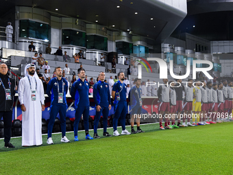 Qatar National team head coach Bartolome Marquez, his staff, and substitutes line up for the national anthem before the FIFA World Cup 2026...