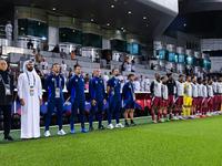 Qatar National team head coach Bartolome Marquez, his staff, and substitutes line up for the national anthem before the FIFA World Cup 2026...