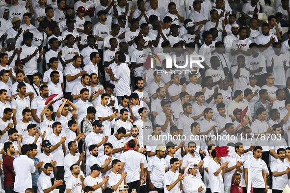 Fans of Qatar cheer during the FIFA World Cup 2026 AFC Asian Qualifiers 3rd round group A match between Qatar and Uzbekistan at Jassim Bin H...