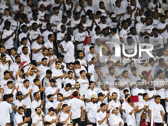 Fans of Qatar cheer during the FIFA World Cup 2026 AFC Asian Qualifiers 3rd round group A match between Qatar and Uzbekistan at Jassim Bin H...