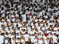 Fans of Qatar cheer during the FIFA World Cup 2026 AFC Asian Qualifiers 3rd round group A match between Qatar and Uzbekistan at Jassim Bin H...