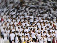 Fans of Qatar cheer during the FIFA World Cup 2026 AFC Asian Qualifiers 3rd round group A match between Qatar and Uzbekistan at Jassim Bin H...