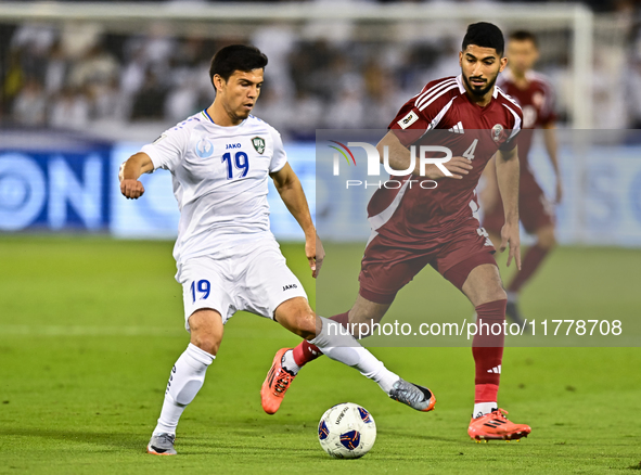 Mohammed Waad (#4) of Qatar competes for the ball with Azizbek Turgunboev (#19) of Uzbekistan during the FIFA World Cup 2026 AFC Asian Quali...