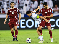 Boualem Khoukhi (#16) of Qatar competes for the ball with Eldor Shomurodov (#14) of Uzbekistan during the FIFA World Cup 2026 AFC Asian Qual...