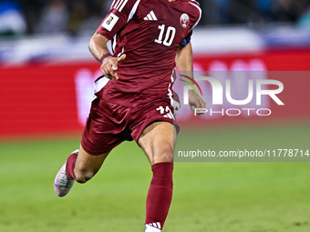 Akram Afif (C) (#10) of Qatar plays in the FIFA World Cup 2026 AFC Asian Qualifiers third round group A match between Qatar and Uzbekistan a...