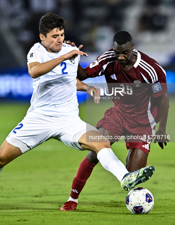 Almoez Ali (#19) of Qatar battles for the ball with Abdukodir Khusanov (#2) of Uzbekistan during the FIFA World Cup 2026 AFC Asian Qualifier...