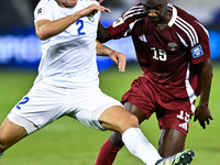 Almoez Ali (#19) of Qatar battles for the ball with Abdukodir Khusanov (#2) of Uzbekistan during the FIFA World Cup 2026 AFC Asian Qualifier...