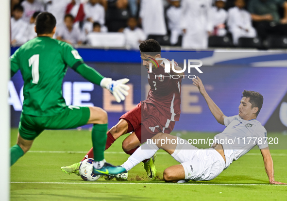 Abdulla Alyazidi (#3) of Qatar battles for the ball with Abdukodir Khusanov (#2) of Uzbekistan during the FIFA World Cup 2026 AFC Asian Qual...