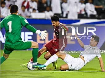 Abdulla Alyazidi (#3) of Qatar battles for the ball with Abdukodir Khusanov (#2) of Uzbekistan during the FIFA World Cup 2026 AFC Asian Qual...