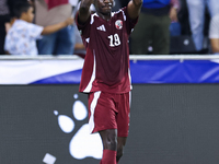 Almoez Ali (#19) of Qatar celebrates after scoring a goal during the FIFA World Cup 2026 AFC Asian Qualifiers third round group A match betw...