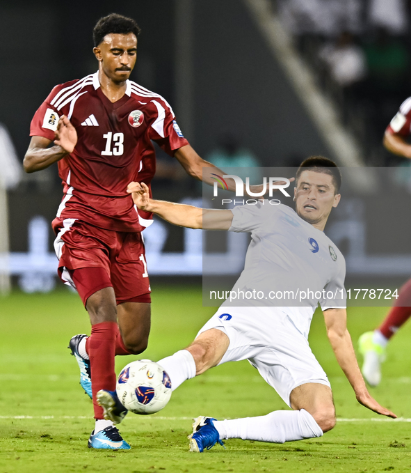 Ibrahim Mohammadali (#13) of Qatar competes for the ball with Odiljo Xamrobekov (#9) of Uzbekistan during the FIFA World Cup 2026 AFC Asian...