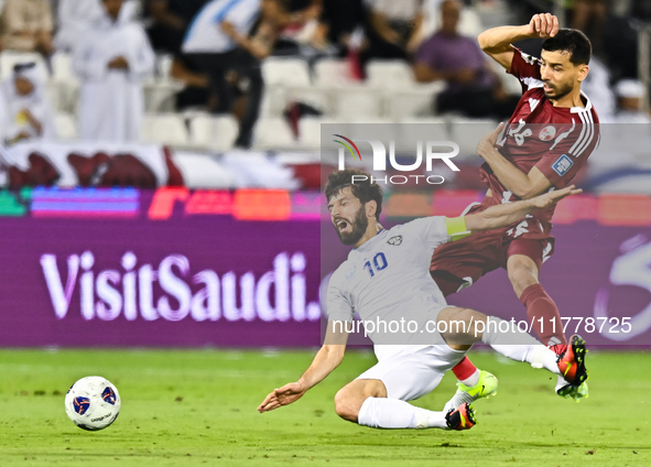 Boualem Khoukhi (#16) of Qatar battles for the ball with Jaloliddin Masharipov (#10) of Uzbekistan during the FIFA World Cup 2026 AFC Asian...