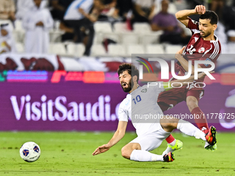 Boualem Khoukhi (#16) of Qatar battles for the ball with Jaloliddin Masharipov (#10) of Uzbekistan during the FIFA World Cup 2026 AFC Asian...