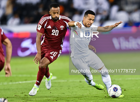 Ahmed Fathy (#20) of Qatar battles for the ball with Bobir Abdixolikov (#17) of Uzbekistan during the FIFA World Cup 2026 AFC Asian Qualifie...