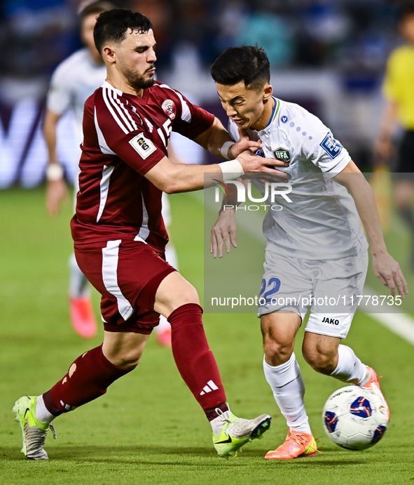 Bassam Alrawi (#15) of Qatar battles for the ball with Abbosbek Fayazullaev (#22) of Uzbekistan during the FIFA World Cup 2026 AFC Asian Qua...