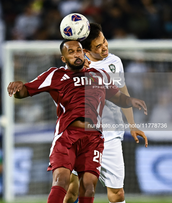 Ahmed Fathy (#20) of Qatar battles for the ball with Otabek Shukurov (#7) of Uzbekistan during the FIFA World Cup 2026 AFC Asian Qualifiers...