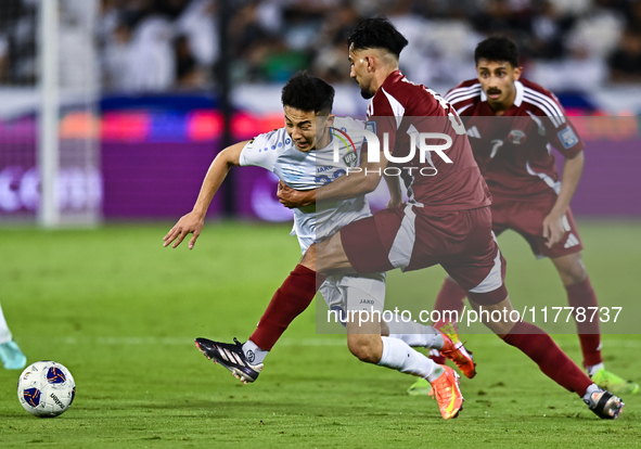 Tarek Salmann of Qatar battles for the ball with Abbosbek Fayazullaev of Uzbekistan during the FIFA World Cup 2026 AFC Asian Qualifiers thir...