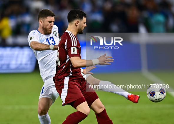 Bassam Alrawi of Qatar battles for the ball with Sherzod Asullaev of Uzbekistan during the FIFA World Cup 2026 AFC Asian Qualifiers third ro...