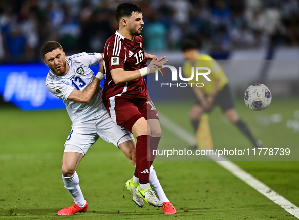 Bassam Alrawi of Qatar battles for the ball with Sherzod Asullaev of Uzbekistan during the FIFA World Cup 2026 AFC Asian Qualifiers third ro...