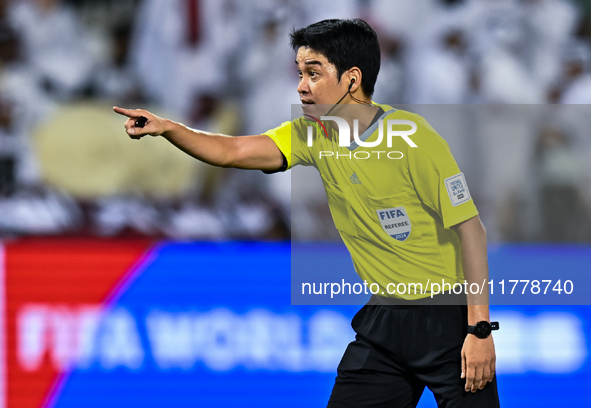 South Korean referee Kim Jong Hyeok gestures during the FIFA World Cup 2026 AFC Asian Qualifiers third round group A match between Qatar and...