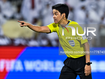 South Korean referee Kim Jong Hyeok gestures during the FIFA World Cup 2026 AFC Asian Qualifiers third round group A match between Qatar and...