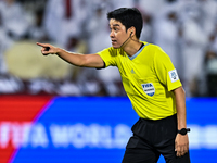 South Korean referee Kim Jong Hyeok gestures during the FIFA World Cup 2026 AFC Asian Qualifiers third round group A match between Qatar and...