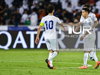 Abbosbek Fayazullaev (R) of Uzbekistan celebrates with his teammate after scoring a goal during the FIFA World Cup 2026 AFC Asian Qualifiers...