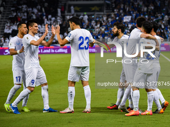 Abbosbek Fayazullaev (R) of Uzbekistan celebrates with his teammate after scoring a goal during the FIFA World Cup 2026 AFC Asian Qualifiers...