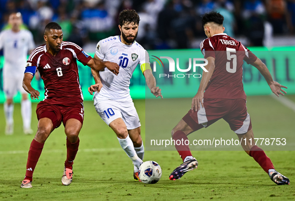 Tarek Salmann of Qatar battles for the ball with Jaloliddin Masharipov of Uzbekistan during the FIFA World Cup 2026 AFC Asian Qualifiers thi...