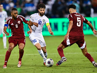 Tarek Salmann of Qatar battles for the ball with Jaloliddin Masharipov of Uzbekistan during the FIFA World Cup 2026 AFC Asian Qualifiers thi...