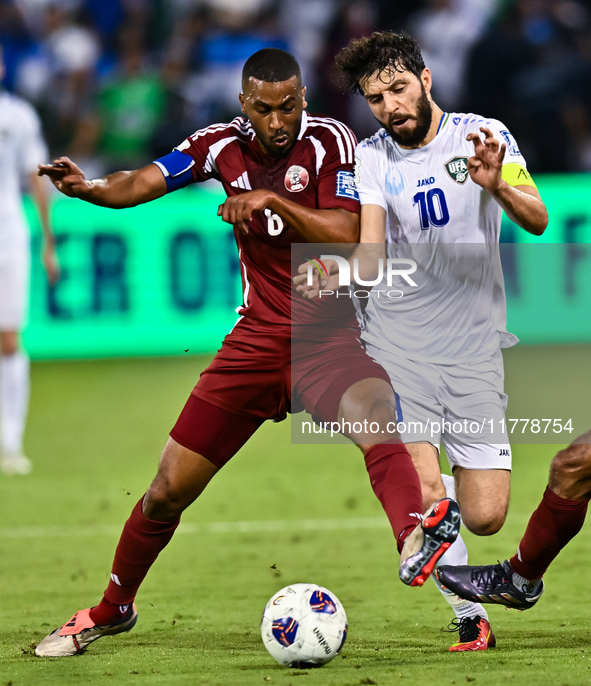 Tarek Salmann of Qatar battles for the ball with Jaloliddin Masharipov of Uzbekistan during the FIFA World Cup 2026 AFC Asian Qualifiers thi...