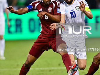 Tarek Salmann of Qatar battles for the ball with Jaloliddin Masharipov of Uzbekistan during the FIFA World Cup 2026 AFC Asian Qualifiers thi...