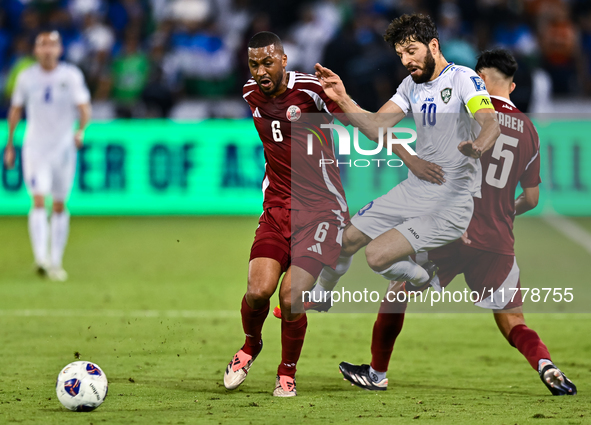 Tarek Salmann of Qatar battles for the ball with Jaloliddin Masharipov of Uzbekistan during the FIFA World Cup 2026 AFC Asian Qualifiers thi...