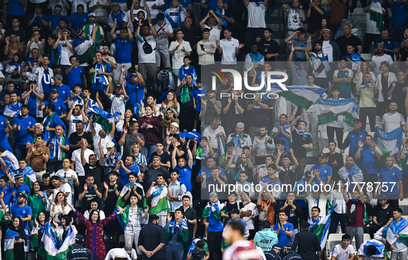 Fans from Uzbekistan cheer during the FIFA World Cup 2026 AFC Asian Qualifiers third round group A match between Qatar and Uzbekistan at Jas...