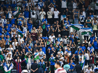 Fans from Uzbekistan cheer during the FIFA World Cup 2026 AFC Asian Qualifiers third round group A match between Qatar and Uzbekistan at Jas...