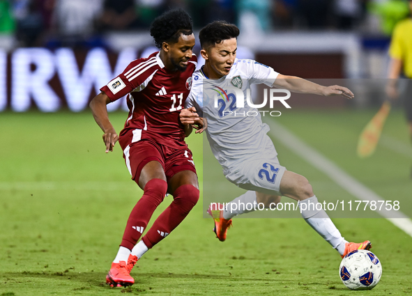 Yusuf Abdurisag (#11) of Qatar battles for the ball with Abbosbek Fayazullaev (#22) of Uzbekistan during the FIFA World Cup 2026 AFC Asian Q...