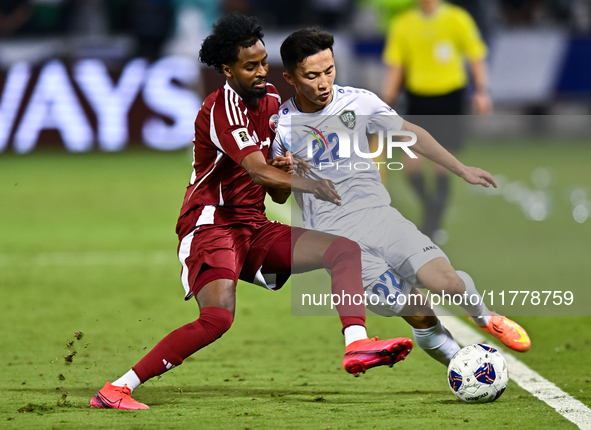 Yusuf Abdurisag (#11) of Qatar battles for the ball with Abbosbek Fayazullaev (#22) of Uzbekistan during the FIFA World Cup 2026 AFC Asian Q...