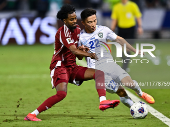 Yusuf Abdurisag (#11) of Qatar battles for the ball with Abbosbek Fayazullaev (#22) of Uzbekistan during the FIFA World Cup 2026 AFC Asian Q...