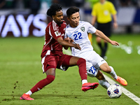 Yusuf Abdurisag (#11) of Qatar battles for the ball with Abbosbek Fayazullaev (#22) of Uzbekistan during the FIFA World Cup 2026 AFC Asian Q...