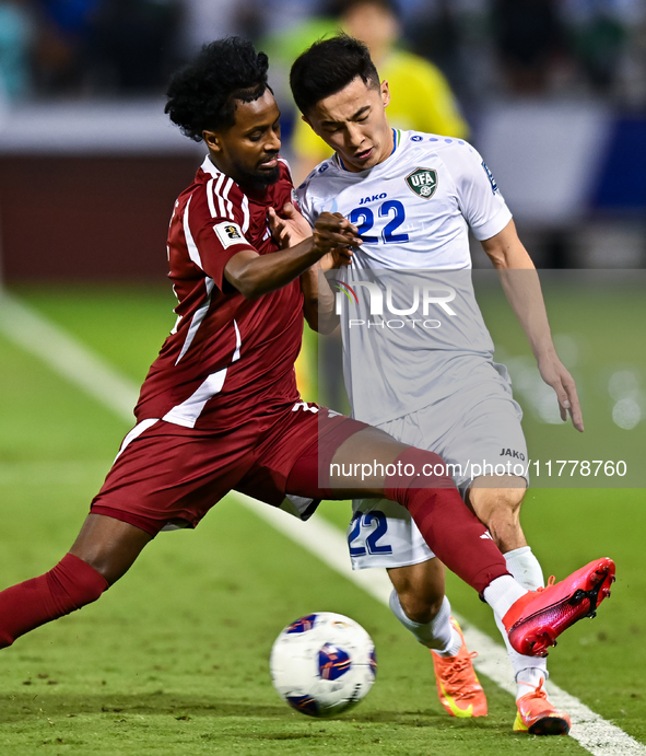 Yusuf Abdurisag (#11) of Qatar battles for the ball with Abbosbek Fayazullaev (#22) of Uzbekistan during the FIFA World Cup 2026 AFC Asian Q...