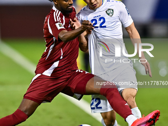 Yusuf Abdurisag (#11) of Qatar battles for the ball with Abbosbek Fayazullaev (#22) of Uzbekistan during the FIFA World Cup 2026 AFC Asian Q...