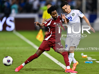 Yusuf Abdurisag (#11) of Qatar battles for the ball with Abbosbek Fayazullaev (#22) of Uzbekistan during the FIFA World Cup 2026 AFC Asian Q...