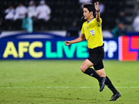 South Korean referee Kim Jong Hyeok gestures during the FIFA World Cup 2026 AFC Asian Qualifiers third round group A match between Qatar and...